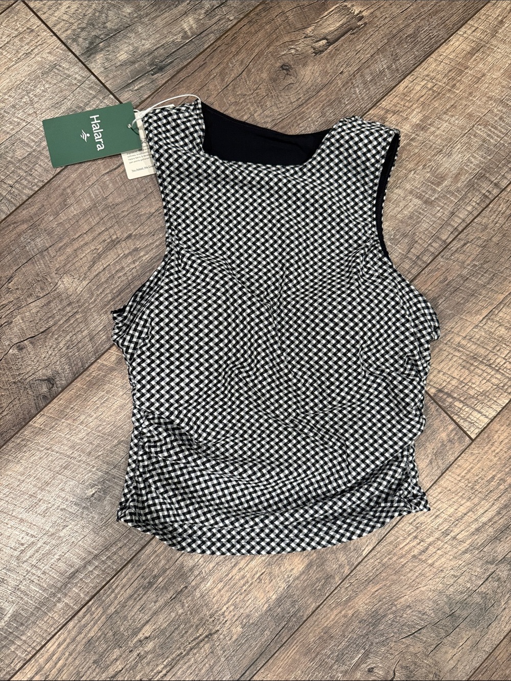 HALARA Black & White Sleeveless Athletic Top with Built-in Bra.